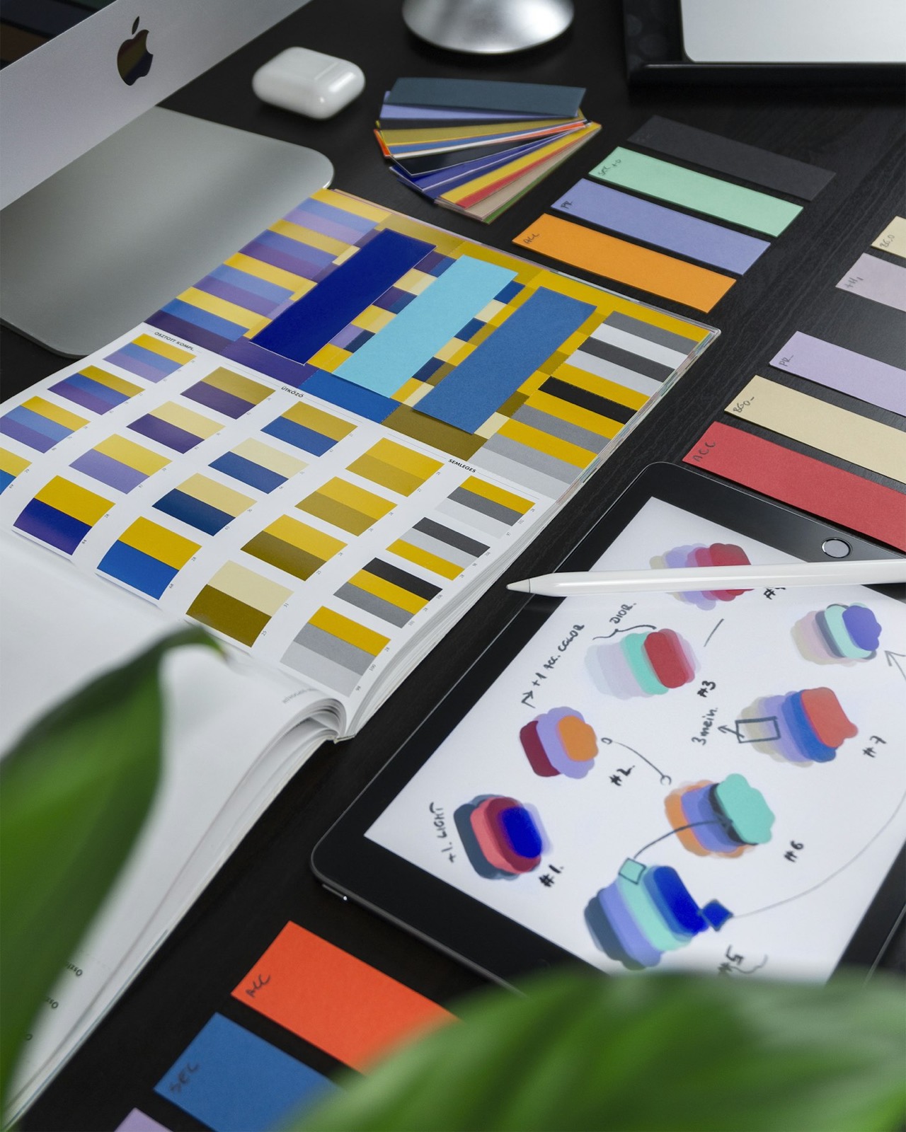 Color swatches and an iPad color study — a named palette, not a vibe